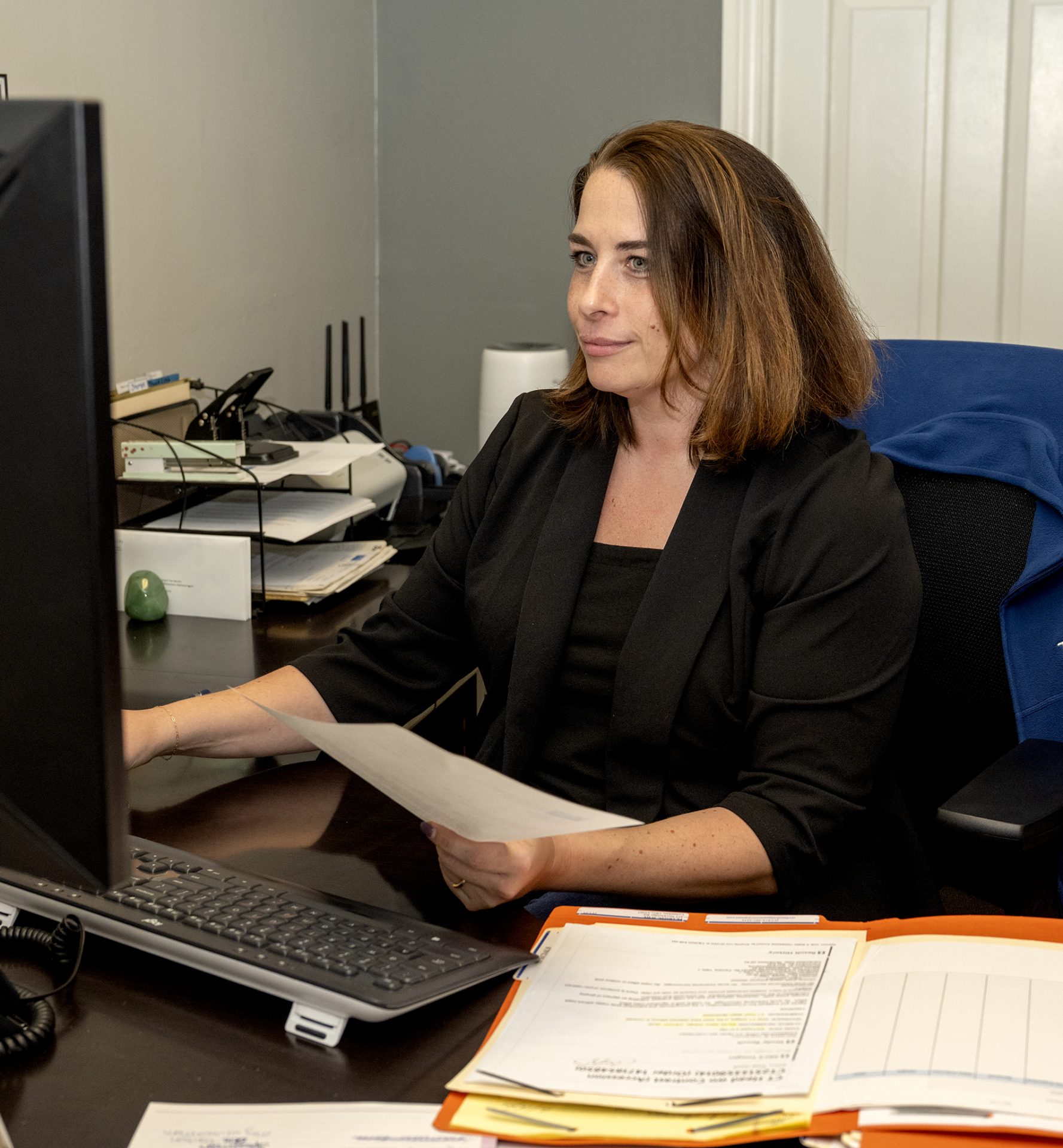 working on computer at Tyack Law firm